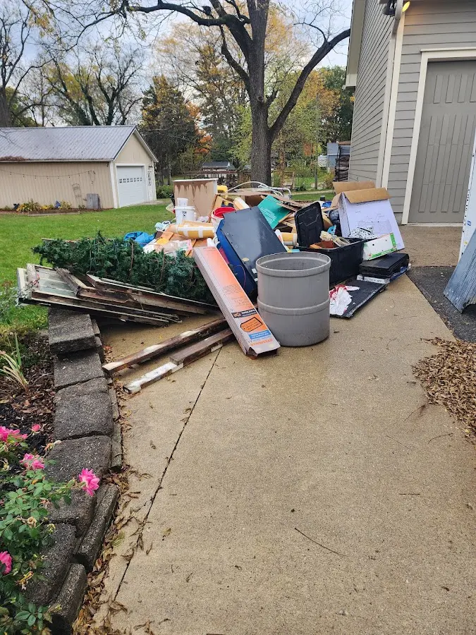 Dumpster being loaded with debris for Commercial Dumpster Rental in Red Hill